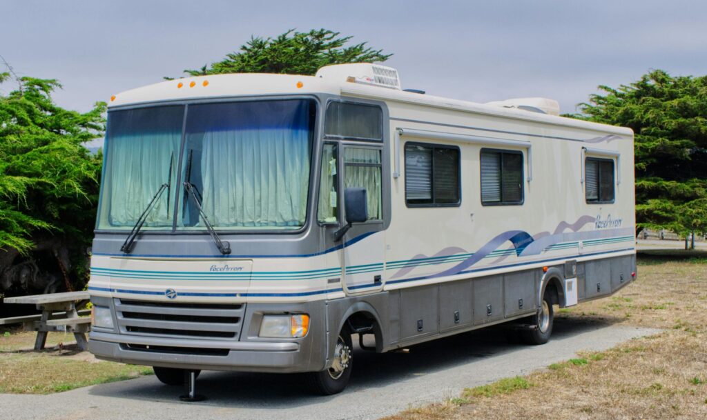 Explore the scenic campsite with a comfortable RV parked at Half Moon Bay.